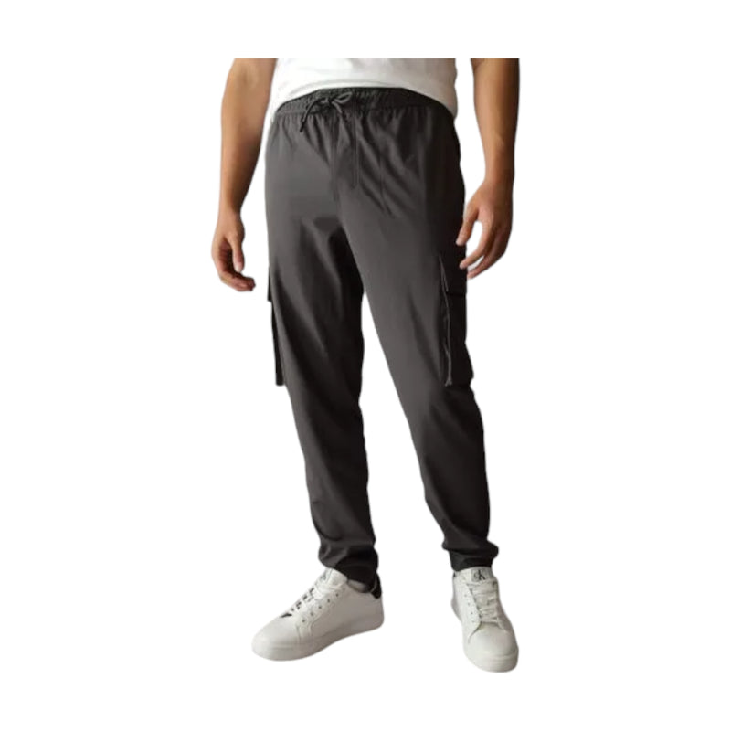 Pantaloni Uomo Calvin Klein - TECHNICAL LOGO REPEAT HWK PANT image url - Grigio